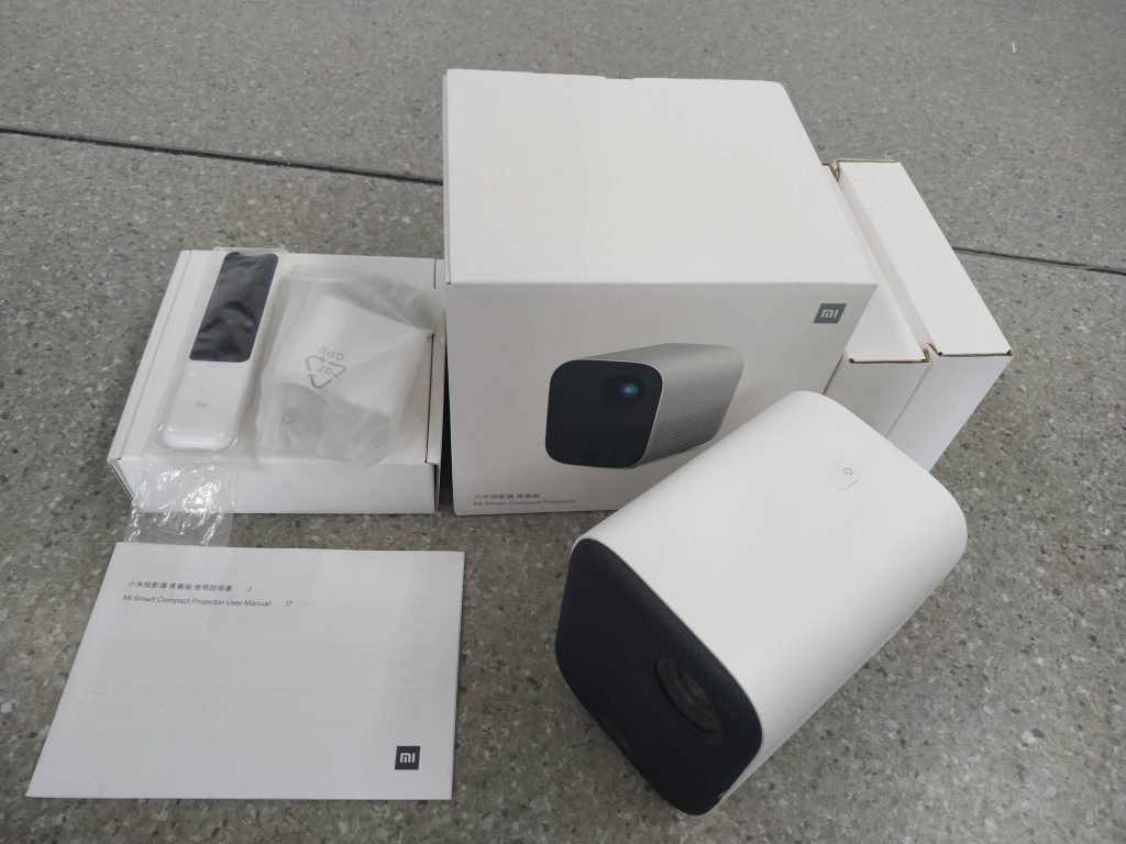 Compact projector. Проектор mi Smart Projector Mini. Коробка mi Smart Compact Projector Mini. Xiaomi mi Smart Compact Projector пульт. Xiaomi 120x.
